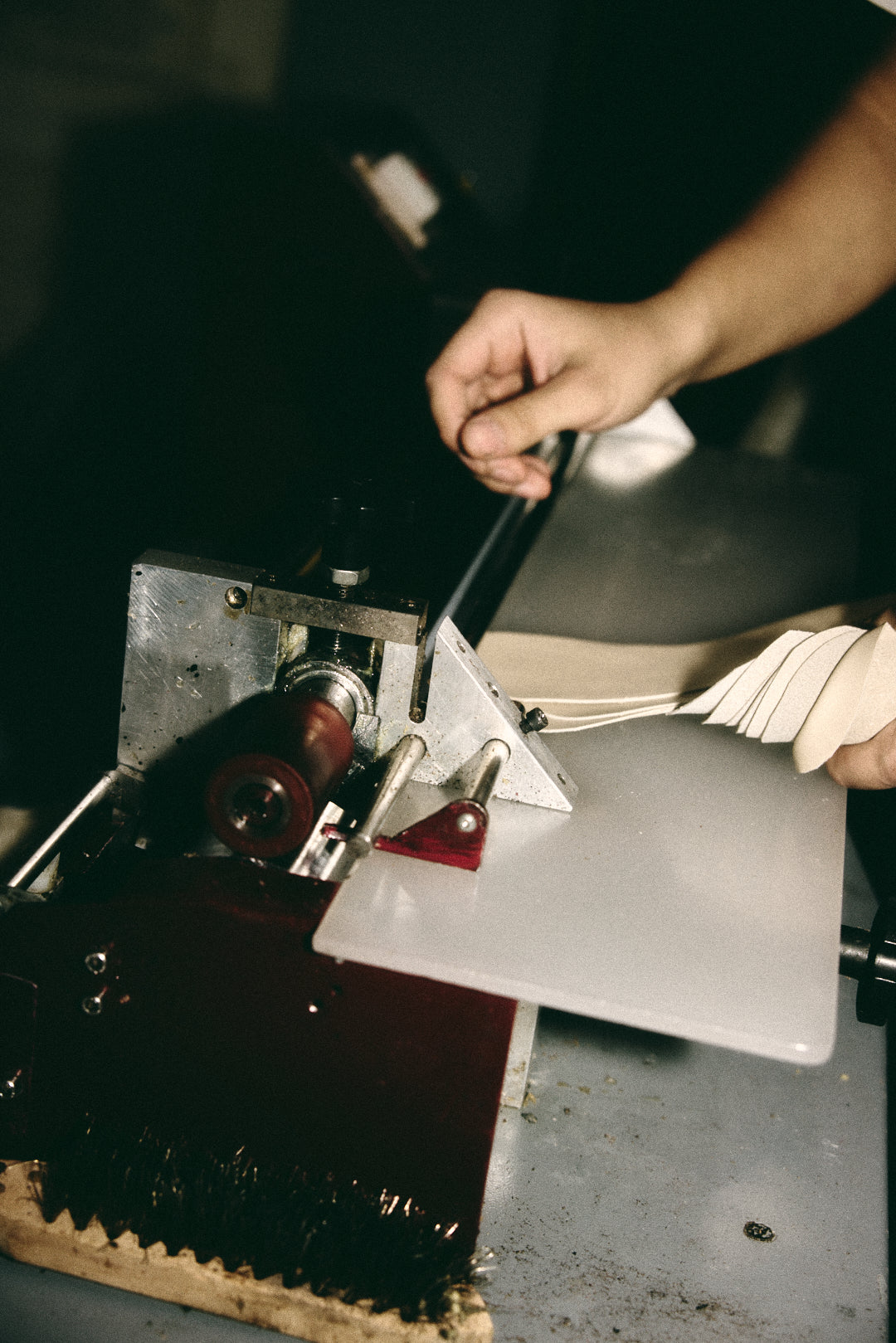 Full-grain leather being hand-inspected and prepared for cutting at Hiva Atelier in Istanbul